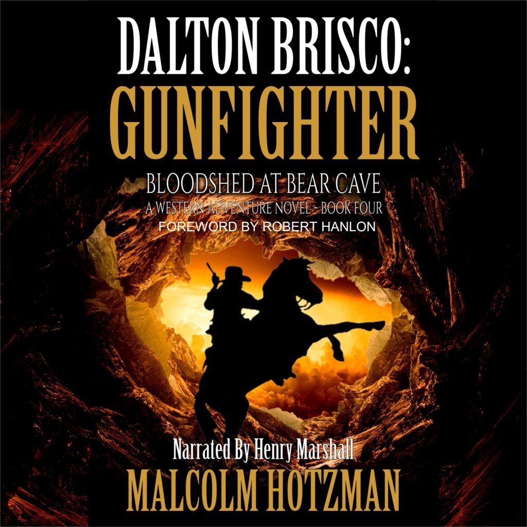 Cowboy on rearing horse against background of western landscape and sunset